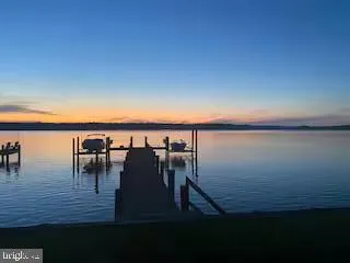 a view of swimming pool with outdoor seating