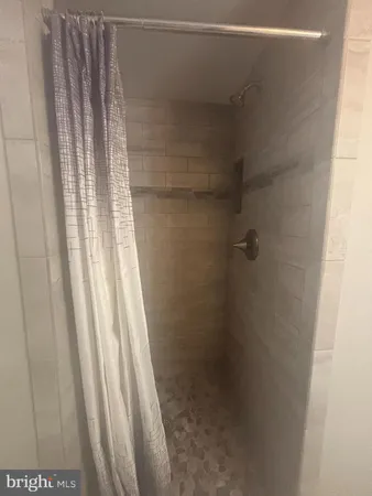 a white toilet sitting next to a window