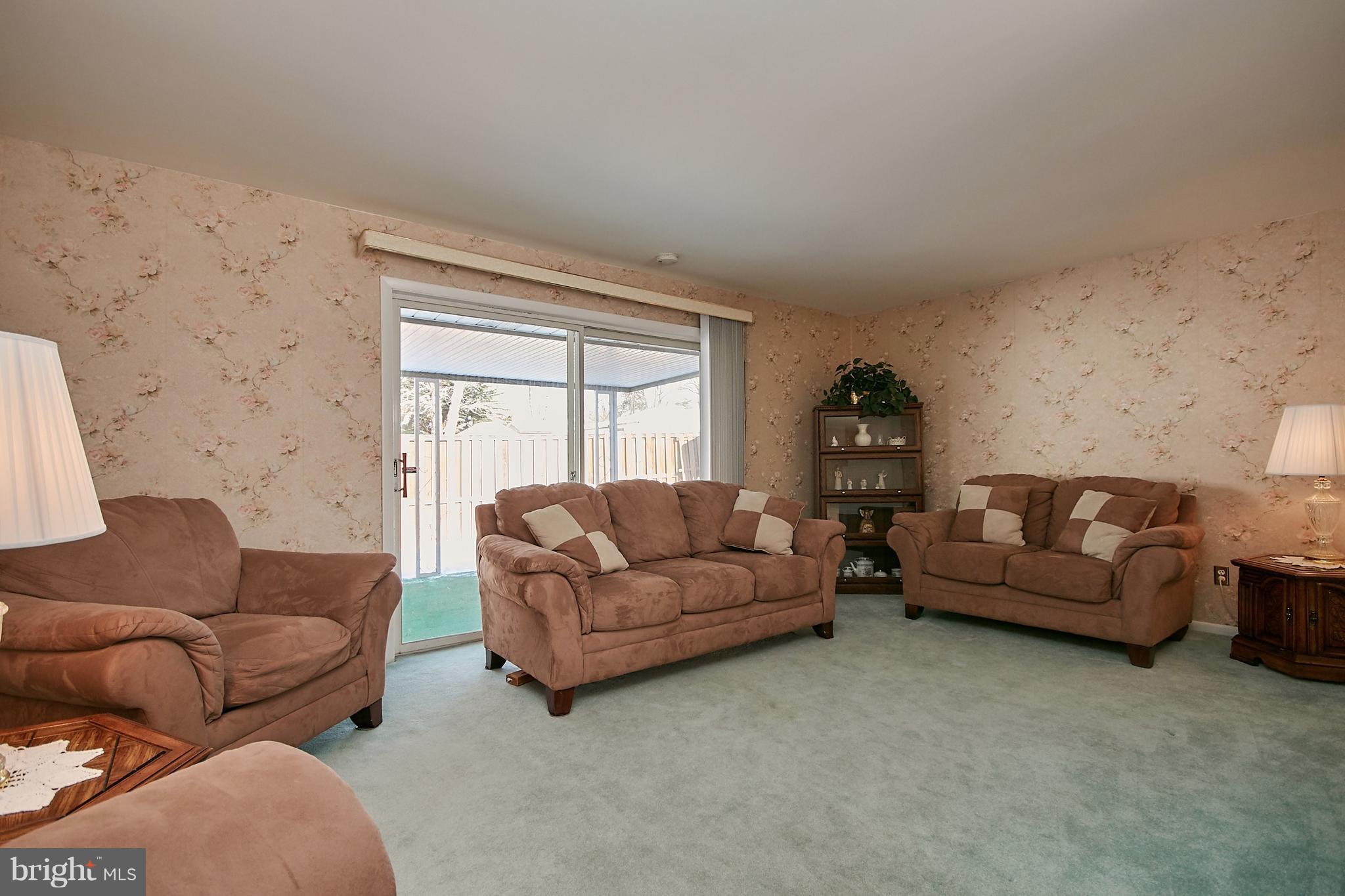 7311 Floyd Avenue Springfield, VA 22150 - Photo 5 of 33 Large Living Room - Sliding Door to Covered Porch