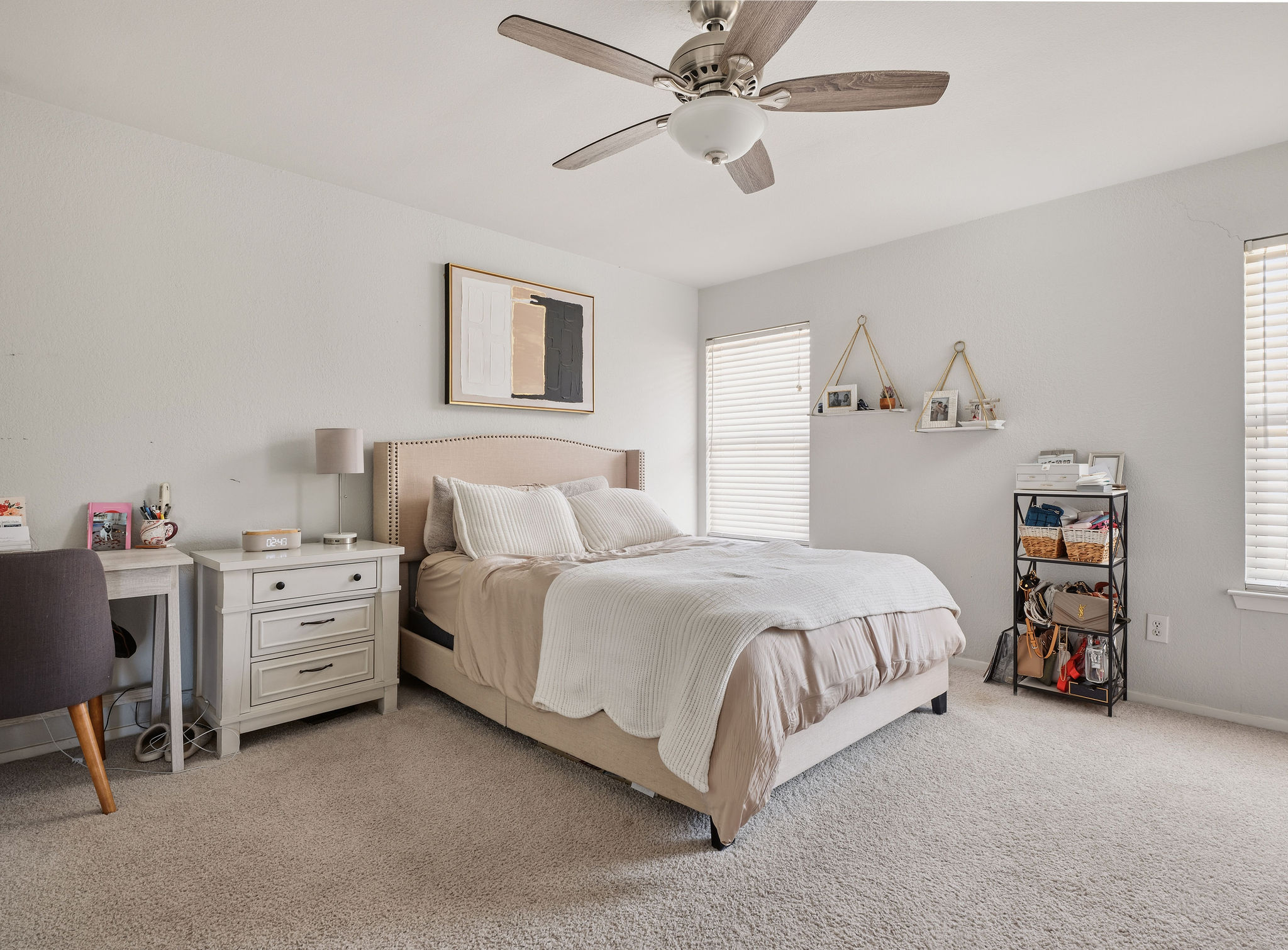 2008 Lear Lane Austin, TX 78745 - Photo 20 of 32 a spacious bedroom with a bed and a chandelier