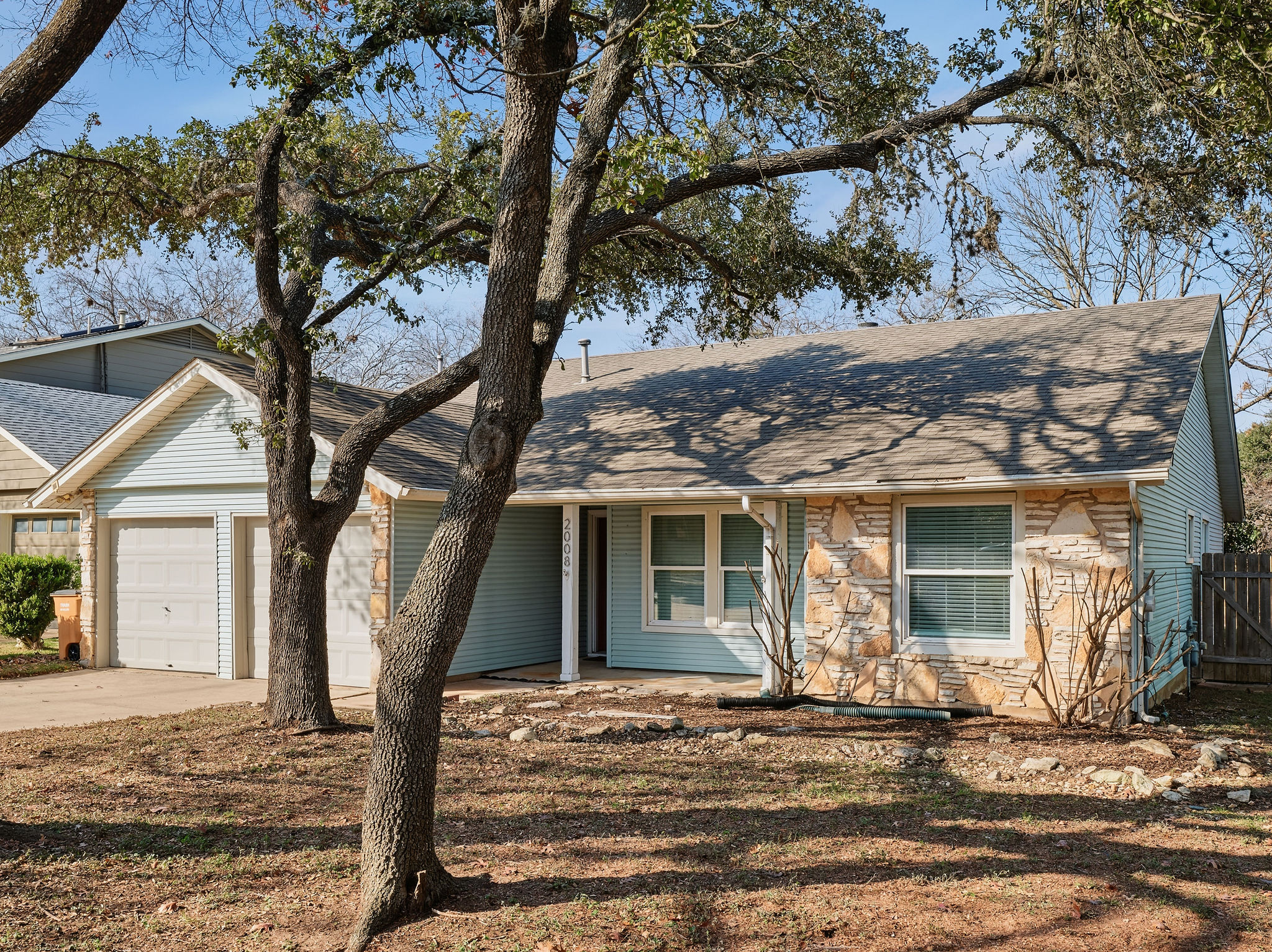 2008 Lear Lane Austin, TX 78745 - Photo 2 of 32 a view of a house with a tree in front of it