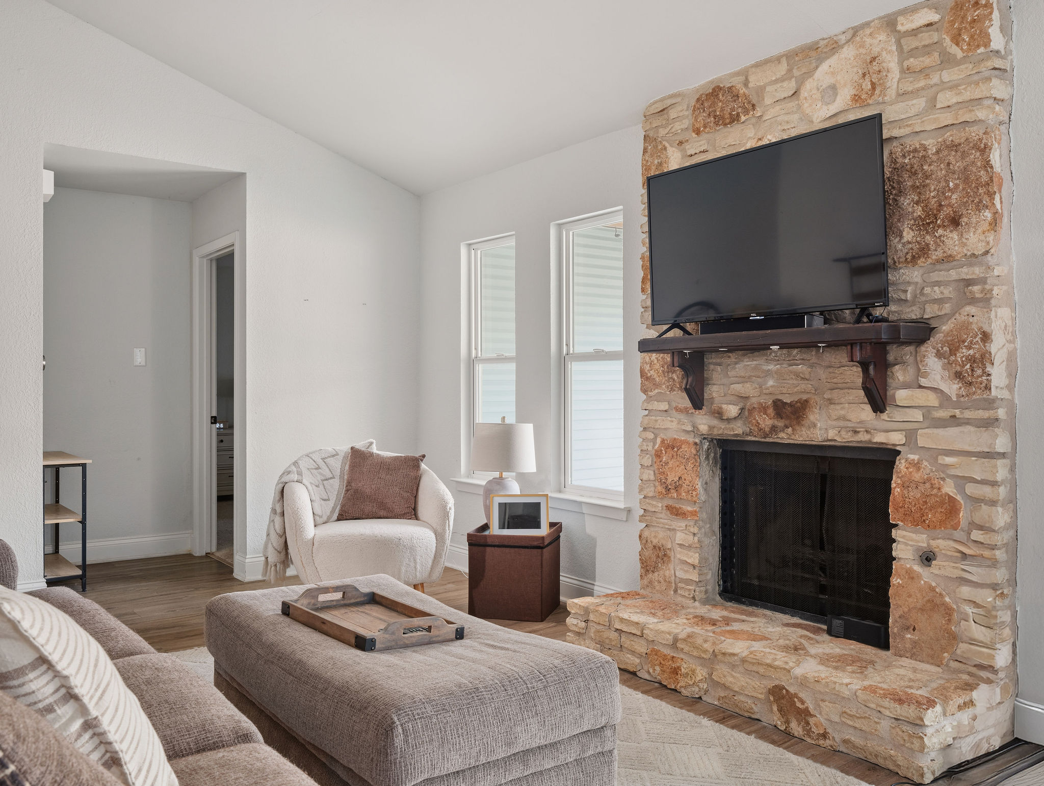2008 Lear Lane Austin, TX 78745 - Photo 5 of 32 a living room with furniture a flat screen tv and a fireplace
