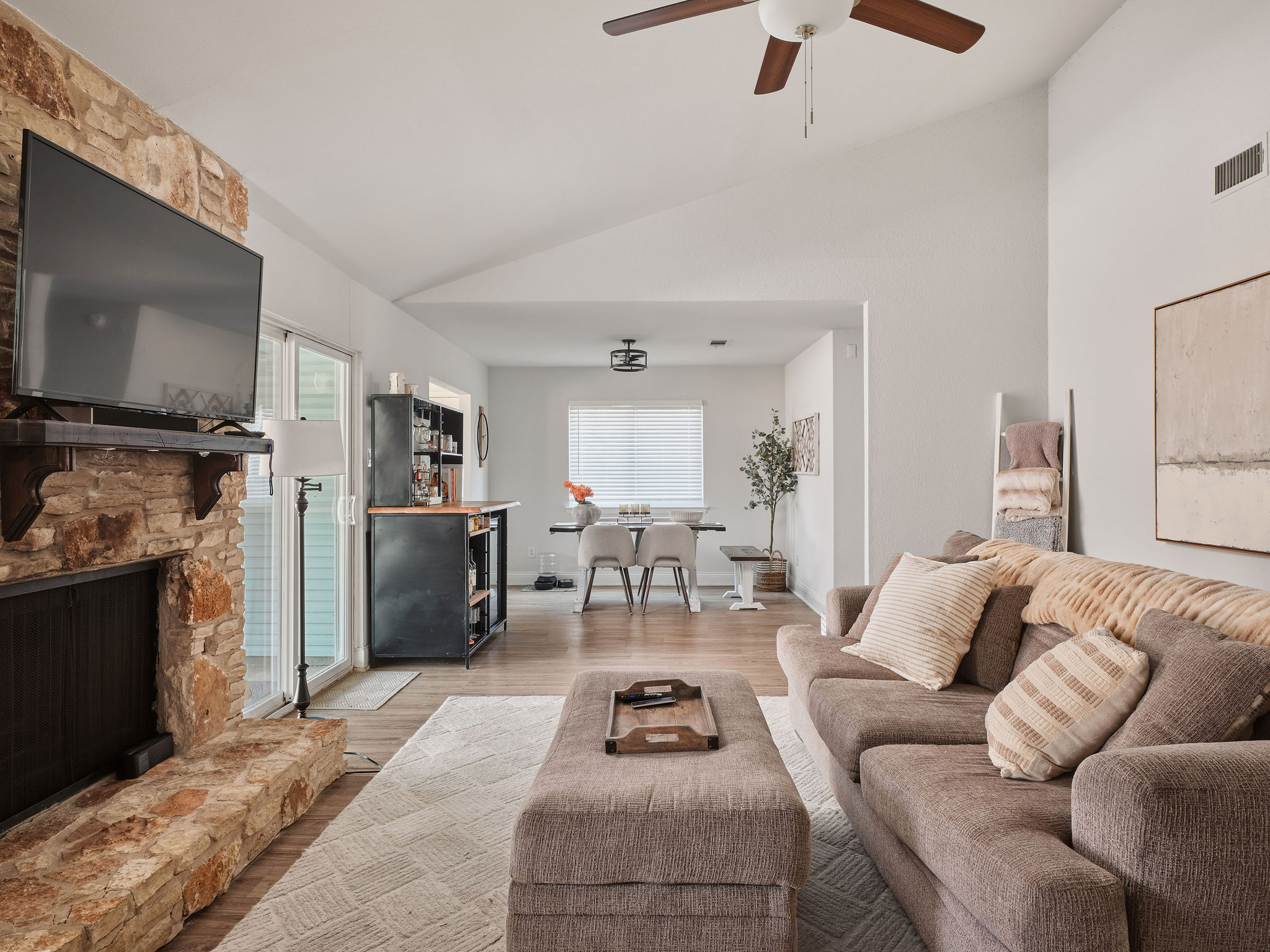 2008 Lear Lane Austin, TX 78745 - Photo 6 of 32 a living room with furniture a flat screen tv and a fireplace