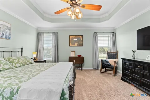 a bedroom with bed and window