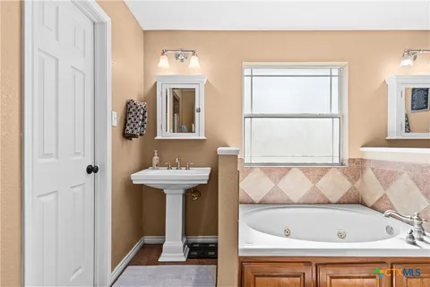 a bathroom with a sink and a bathtub