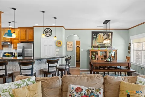 a living room with furniture and windows