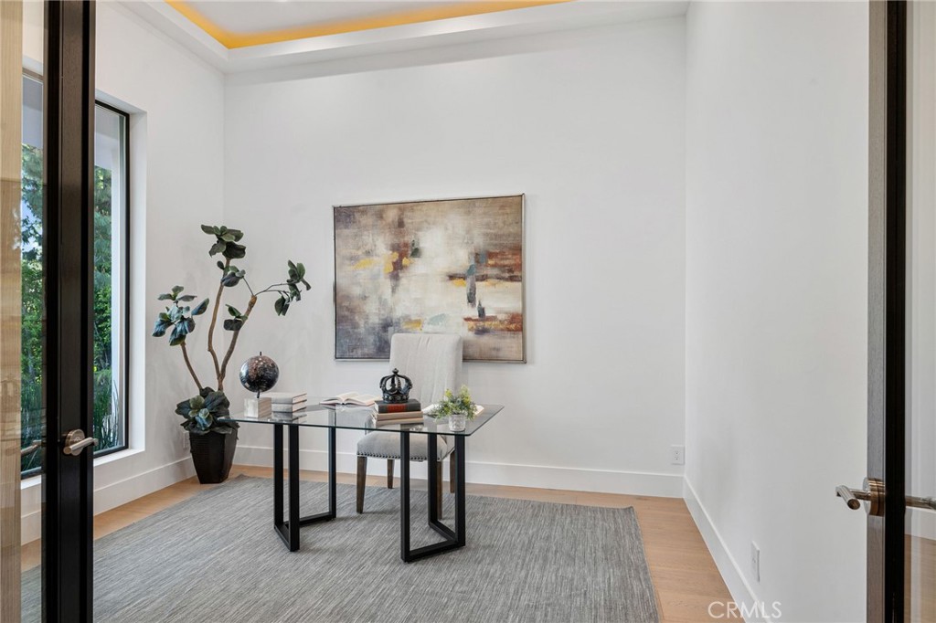 4731 Caritina Drive Tarzana, CA 91356 - Photo 11 of 42 a view of a workspace with furniture and wooden floor