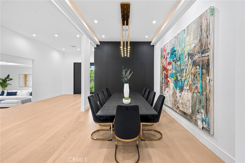 4731 Caritina Drive Tarzana, CA 91356 - Photo 13 of 42 a dining room with furniture and wooden floor