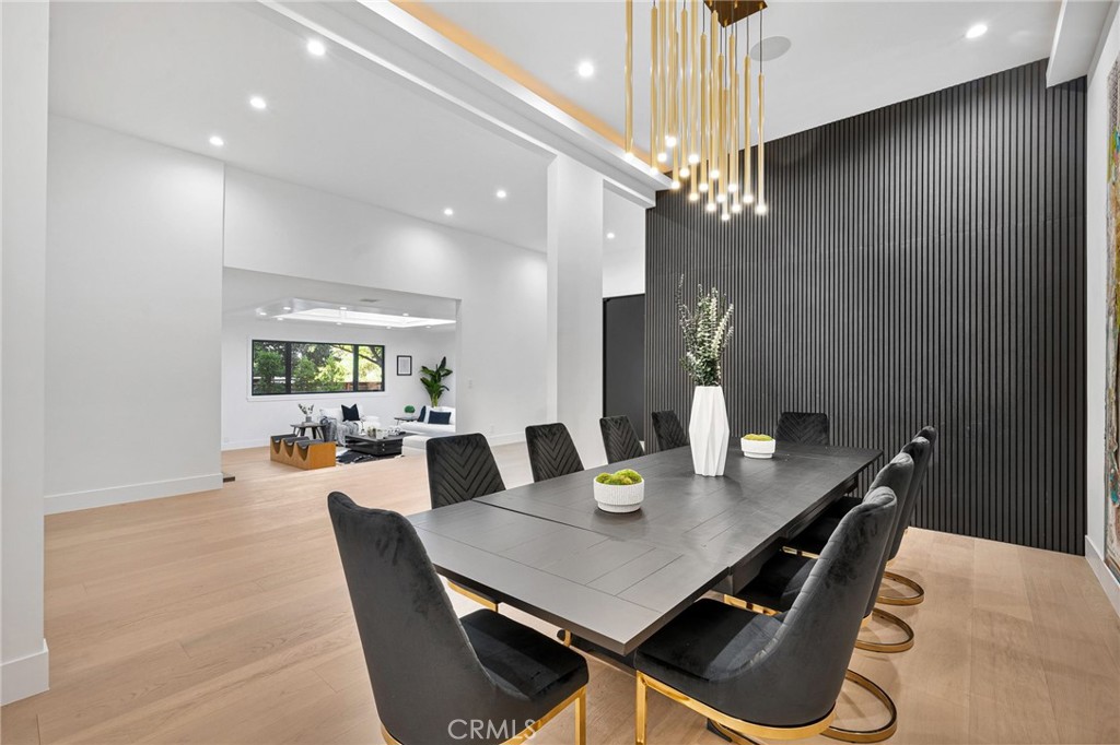 4731 Caritina Drive Tarzana, CA 91356 - Photo 14 of 42 a view of a dining room with furniture and chandelier