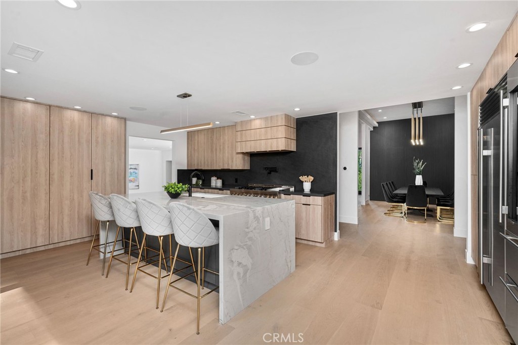 4731 Caritina Drive Tarzana, CA 91356 - Photo 17 of 42 a large white kitchen with a large window