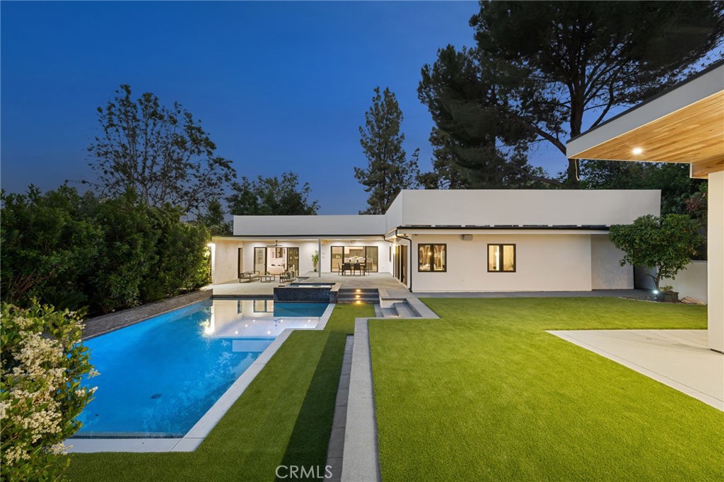 4731 Caritina Drive Tarzana, CA 91356 - Photo 23 of 42 swimming pool view with a seating space and a yard