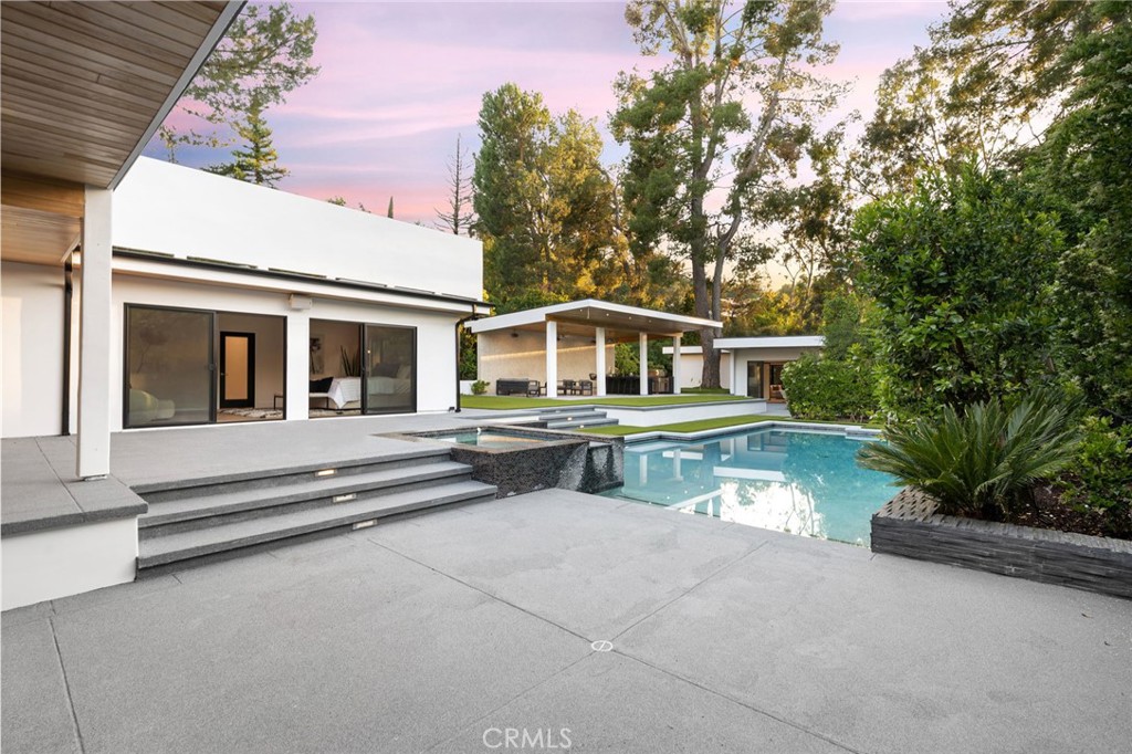 4731 Caritina Drive Tarzana, CA 91356 - Photo 26 of 42 a view of house with swimming pool and sitting area