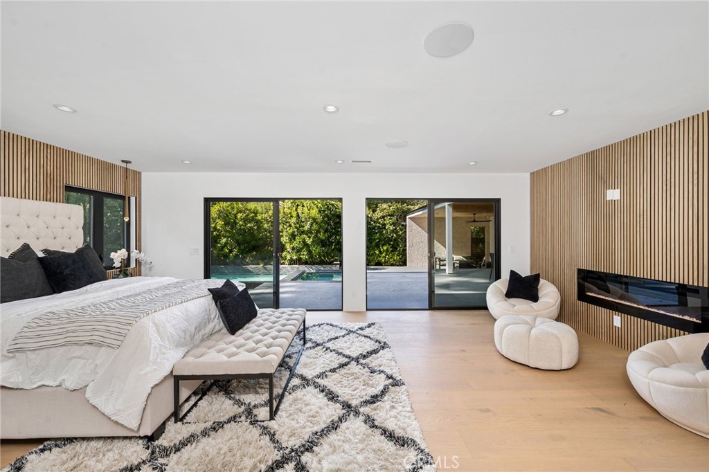 4731 Caritina Drive Tarzana, CA 91356 - Photo 30 of 42 a bedroom with furniture and a large window