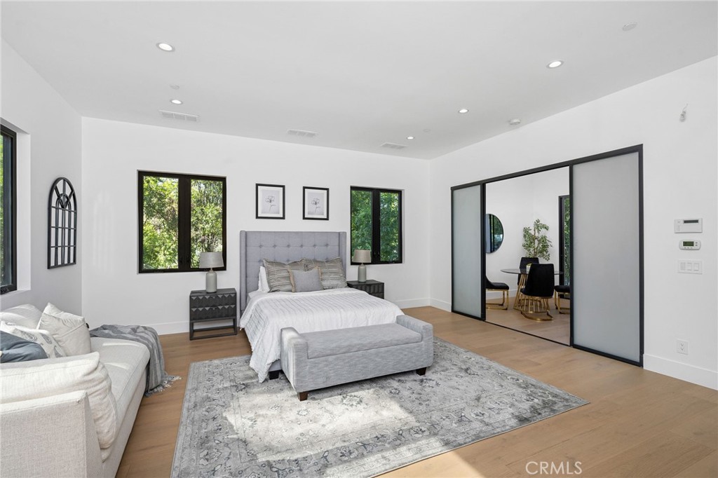 4731 Caritina Drive Tarzana, CA 91356 - Photo 34 of 42 a bedroom with a large bed and a couch