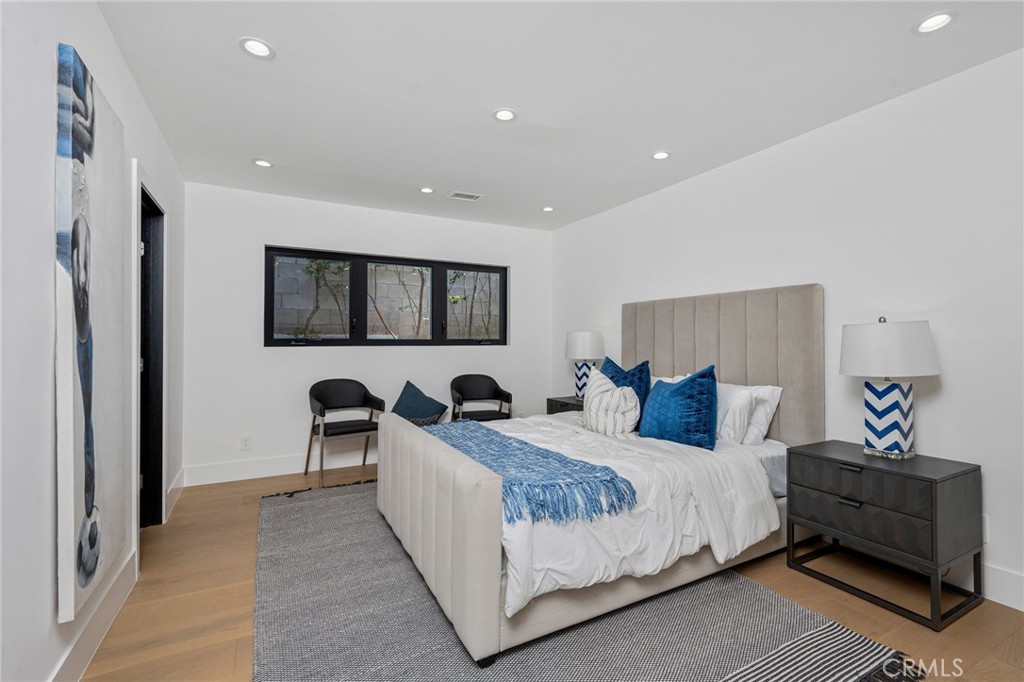 4731 Caritina Drive Tarzana, CA 91356 - Photo 36 of 42 a bedroom with a bed and a couch