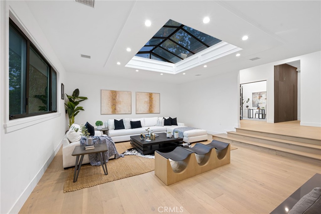 4731 Caritina Drive Tarzana, CA 91356 - Photo 4 of 42 a living room with furniture and a flat screen tv