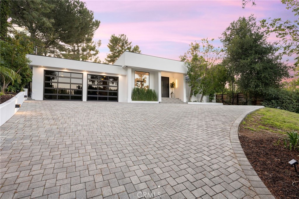 4731 Caritina Drive Tarzana, CA 91356 - Photo 41 of 42 a view of a house with a yard and potted plants