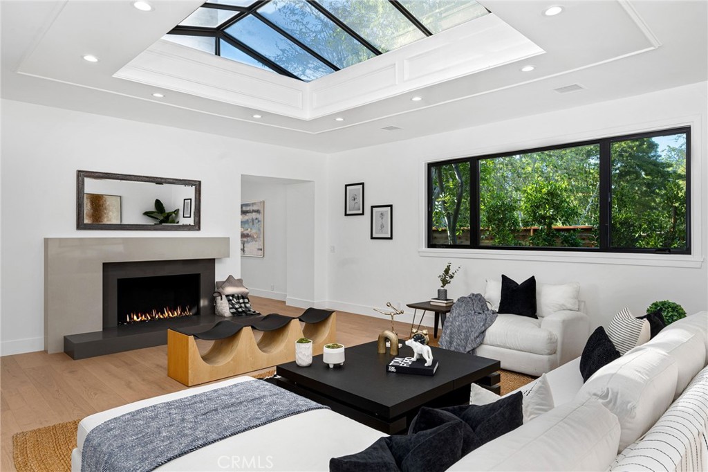 4731 Caritina Drive Tarzana, CA 91356 - Photo 6 of 42 a living room with furniture and a fireplace