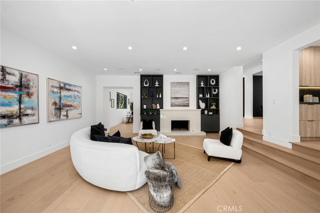 4731 Caritina Drive Tarzana, CA 91356 - Photo 9 of 42 a living room with fireplace furniture and a view of kitchen
