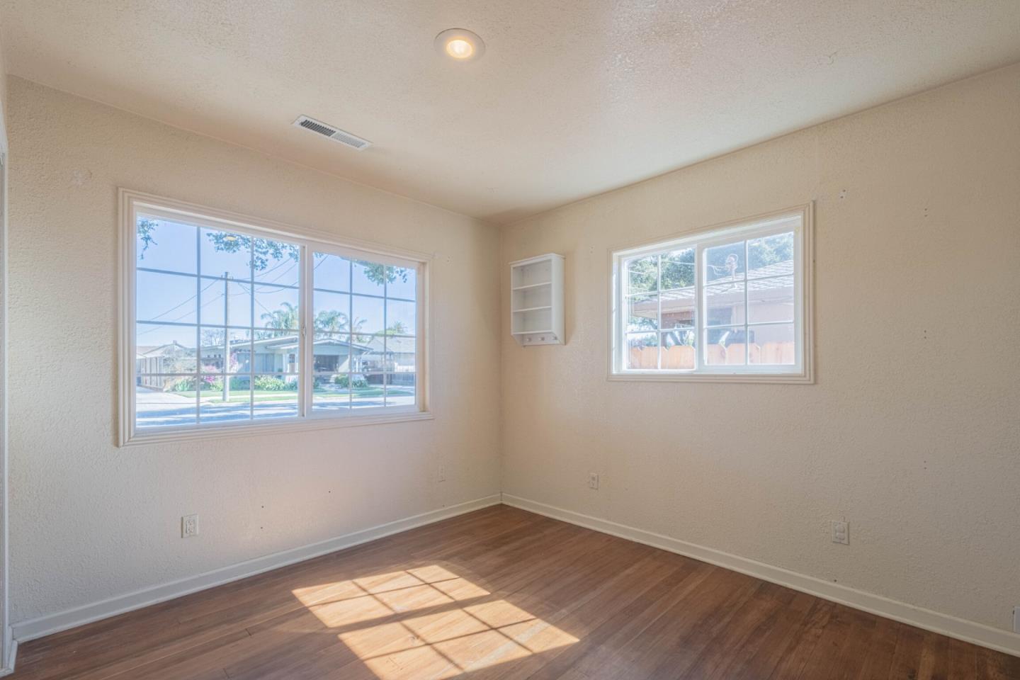 40 Oak Street Salinas, CA 93901 - Photo 20 of 28 an empty room with wooden floor and windows