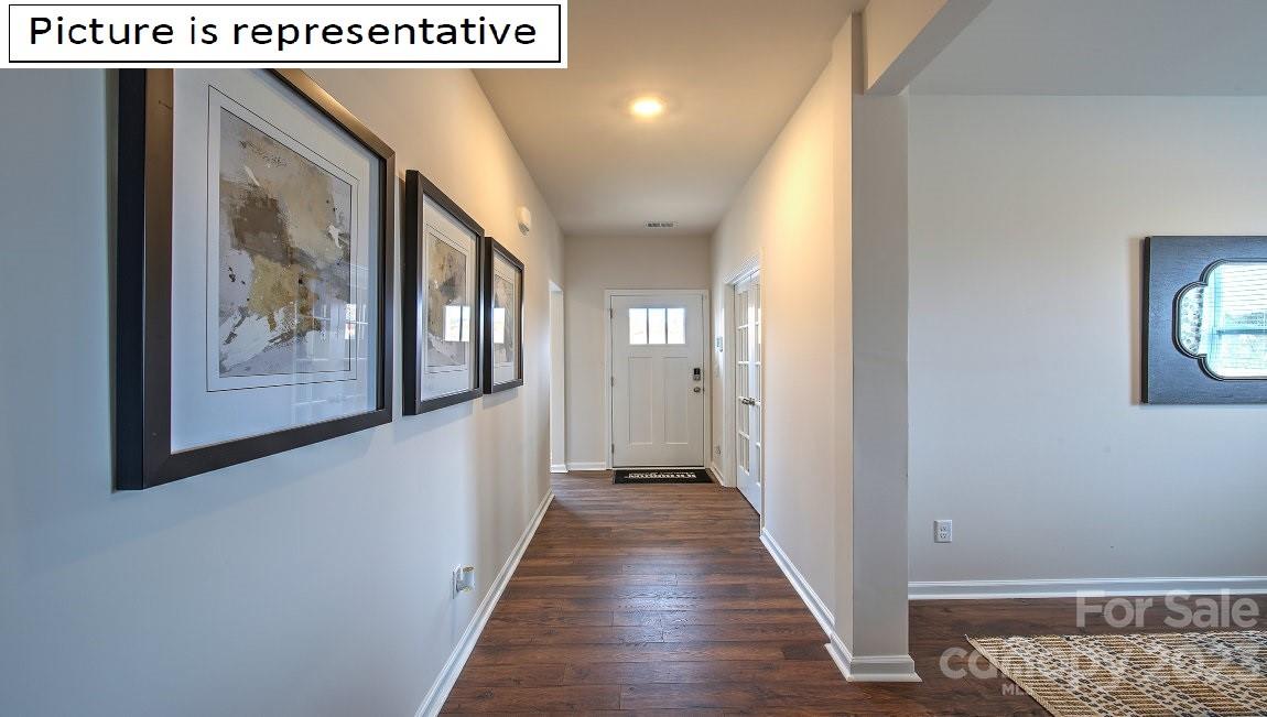 1200 Secrest Cmns Drive Monroe, NC 28112 - Photo 2 of 37 a view of a hallway with wooden floor