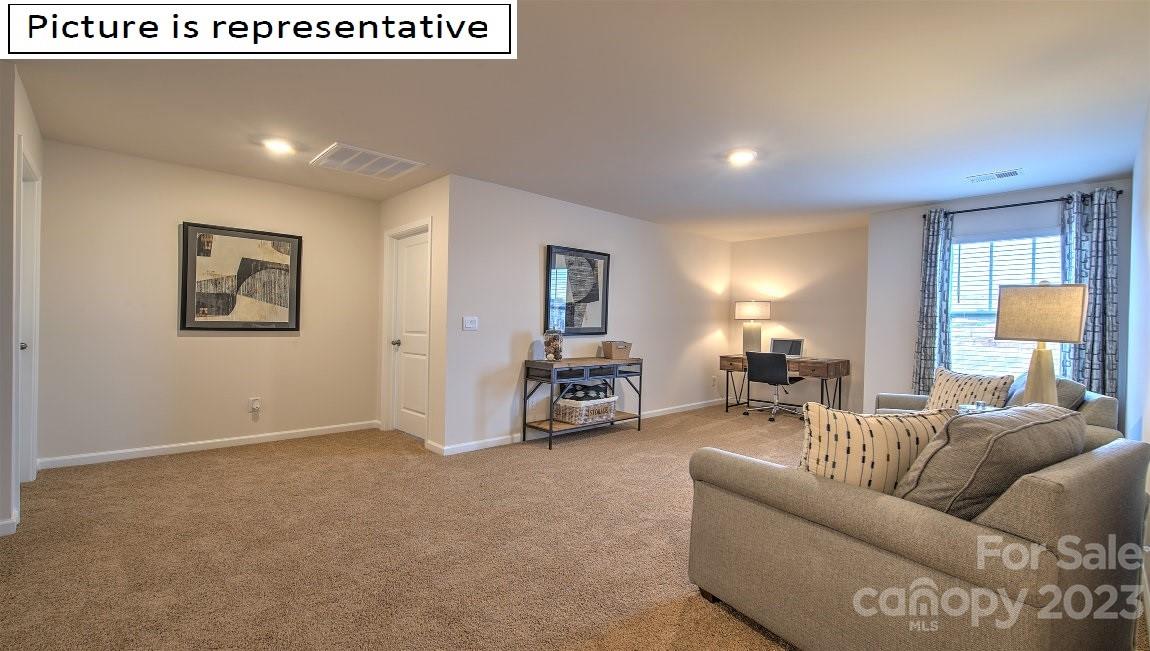 1200 Secrest Cmns Drive Monroe, NC 28112 - Photo 23 of 37 a living room with furniture and a large window
