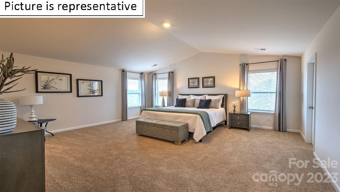 1200 Secrest Cmns Drive Monroe, NC 28112 - Photo 25 of 37 a bedroom with a large bed and a window