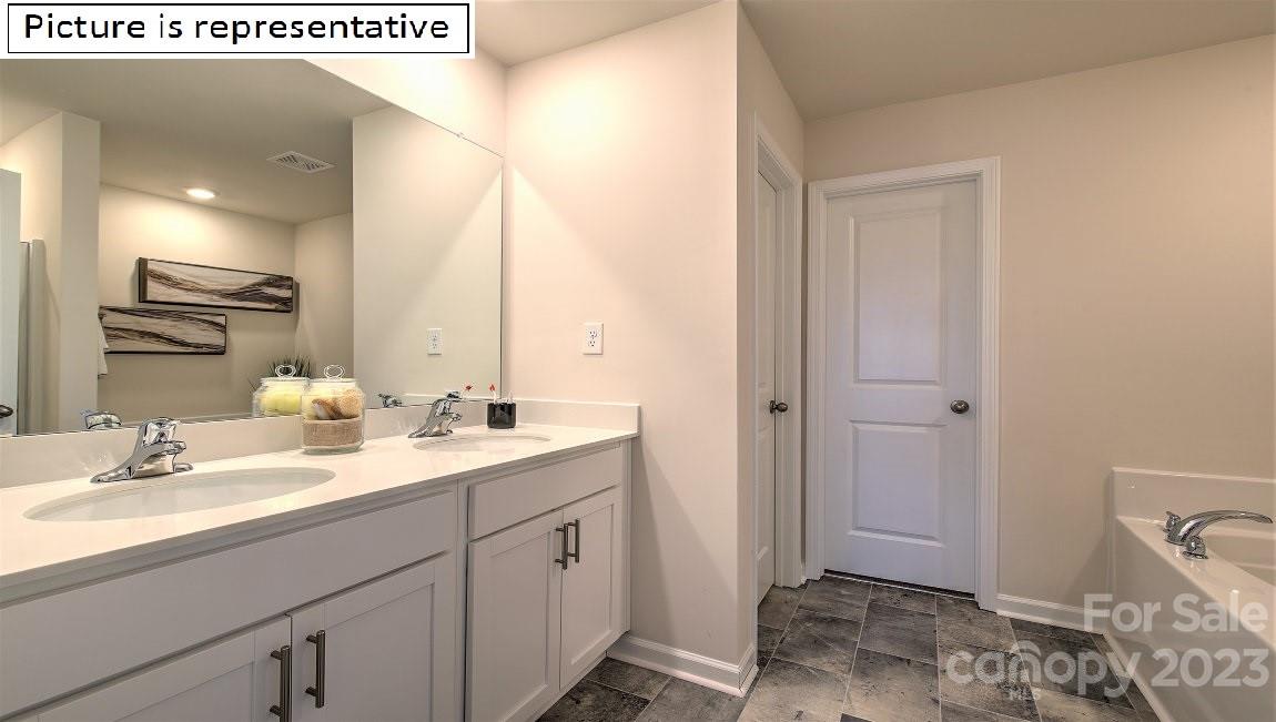1200 Secrest Cmns Drive Monroe, NC 28112 - Photo 29 of 37 a bathroom with a sink a toilet and shower