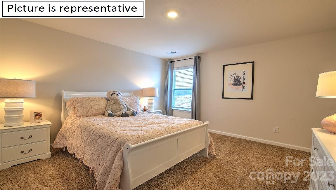 1200 Secrest Cmns Drive Monroe, NC 28112 - Photo 33 of 37 a bedroom with a bed and a window