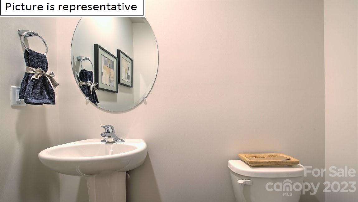 1200 Secrest Cmns Drive Monroe, NC 28112 - Photo 9 of 37 a bathroom with a sink and mirror