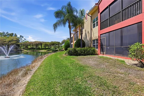 a view of a lake with a house in the background