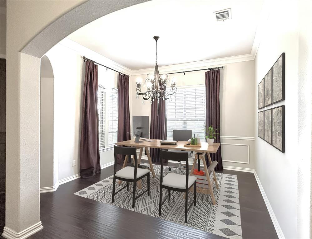 1301 Meadow Ranch Road McKinney, TX 75071 - Photo 13 of 40 Dining space featuring dark wood-style floors, plenty of natural light, arched walkways, a chandelier, and crown molding