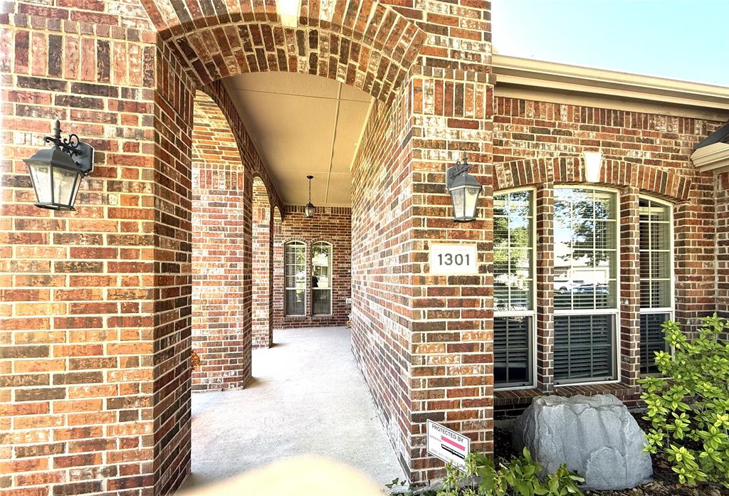 1301 Meadow Ranch Road McKinney, TX 75071 - Photo 6 of 40 Property entrance with brick siding