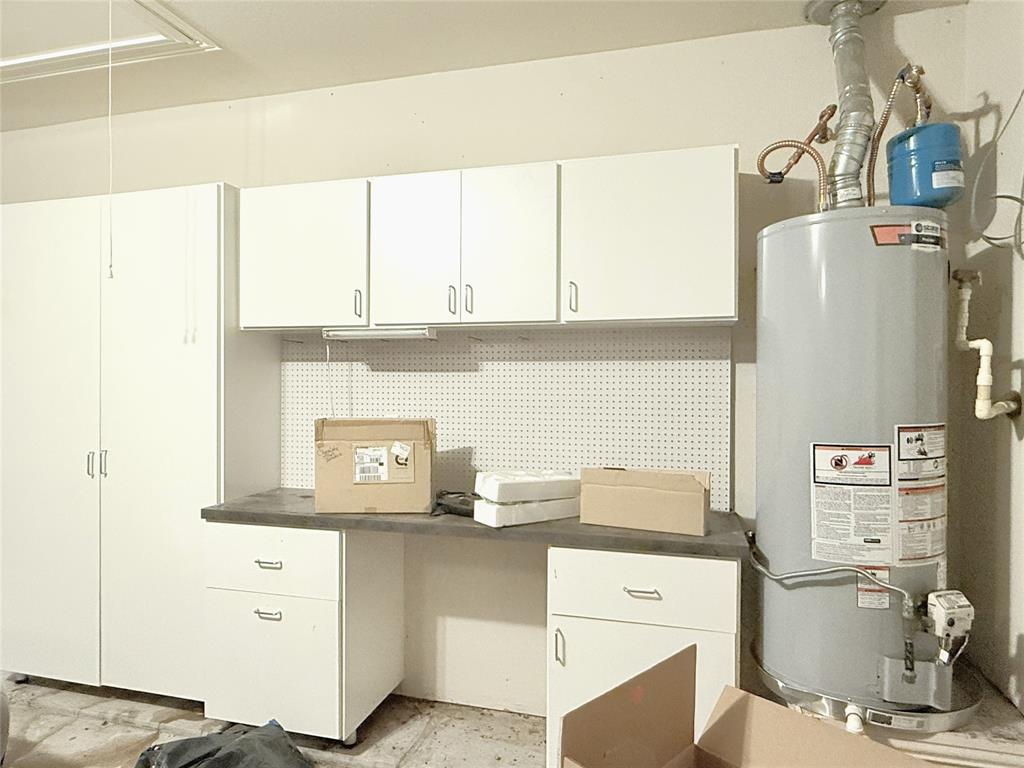 1301 Meadow Ranch Road McKinney, TX 75071 - Photo 9 of 40 Office area featuring gas water heater and attic access