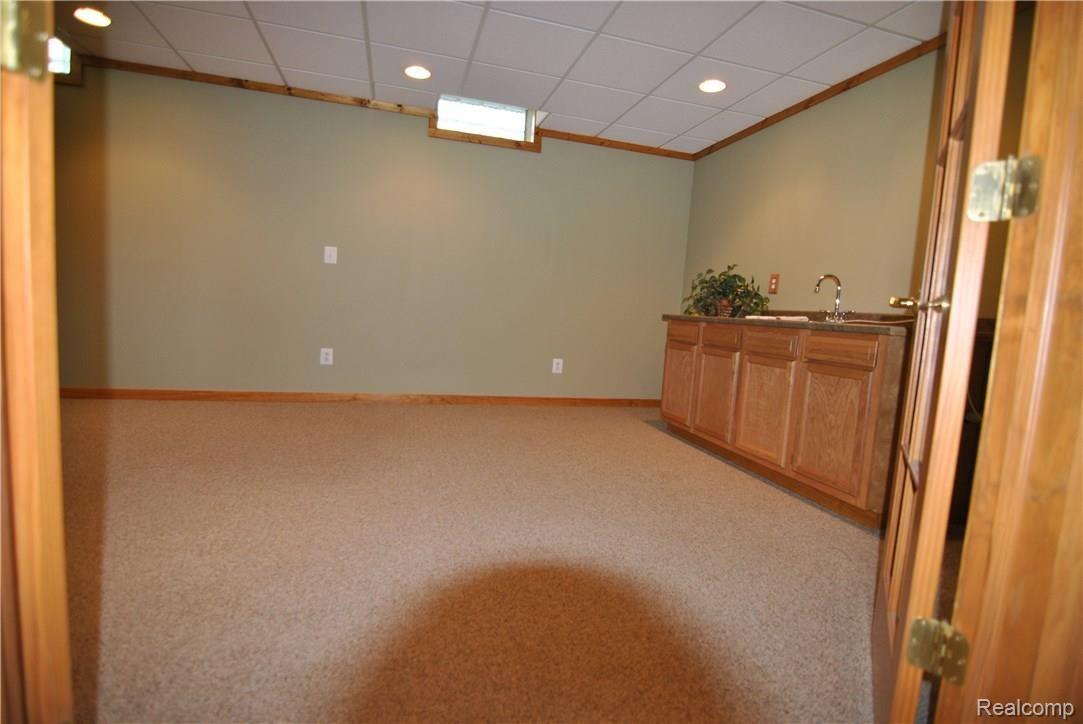 2497 East Clyde Road Howell, MI 48855 - Photo 51 of 95 Rec Rm or non-conforming credenza style 4th bedroom.