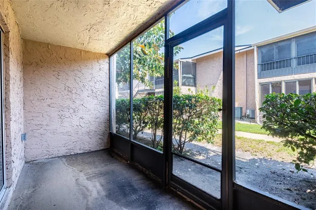 a view of a glass door with a balcony