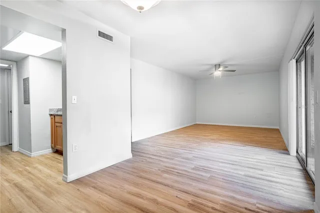 an empty room with wooden floor