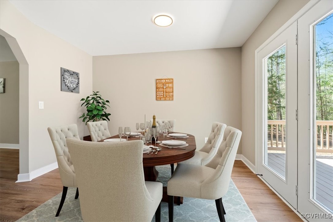 312 Clinton Road Cumberland, VA 23040 - Photo 12 of 29 Dining area featuring baseboards, arched walkways,