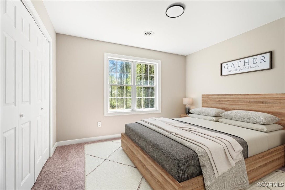 312 Clinton Road Cumberland, VA 23040 - Photo 16 of 29 Bedroom featuring carpet, visible vents, a closet,