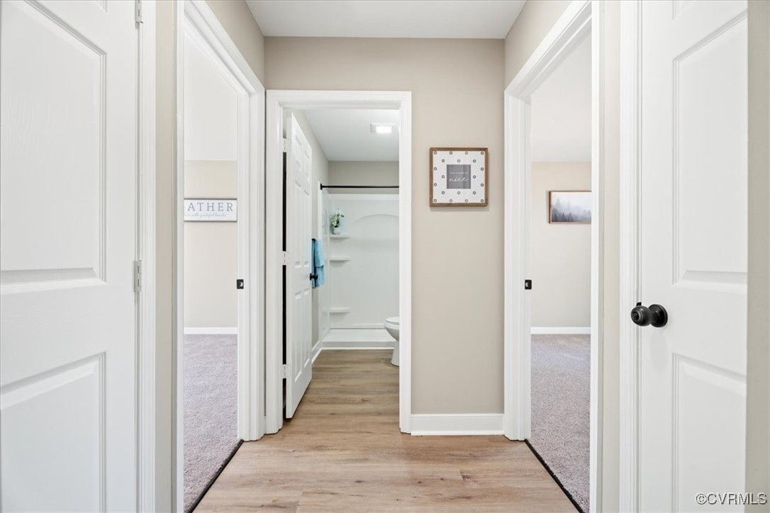 312 Clinton Road Cumberland, VA 23040 - Photo 17 of 29 Hallway with light wood-style flooring and baseboa