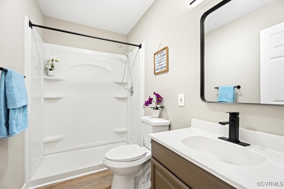 312 Clinton Road Cumberland, VA 23040 - Photo 18 of 29 Full bathroom with toilet, wood finished floors, v