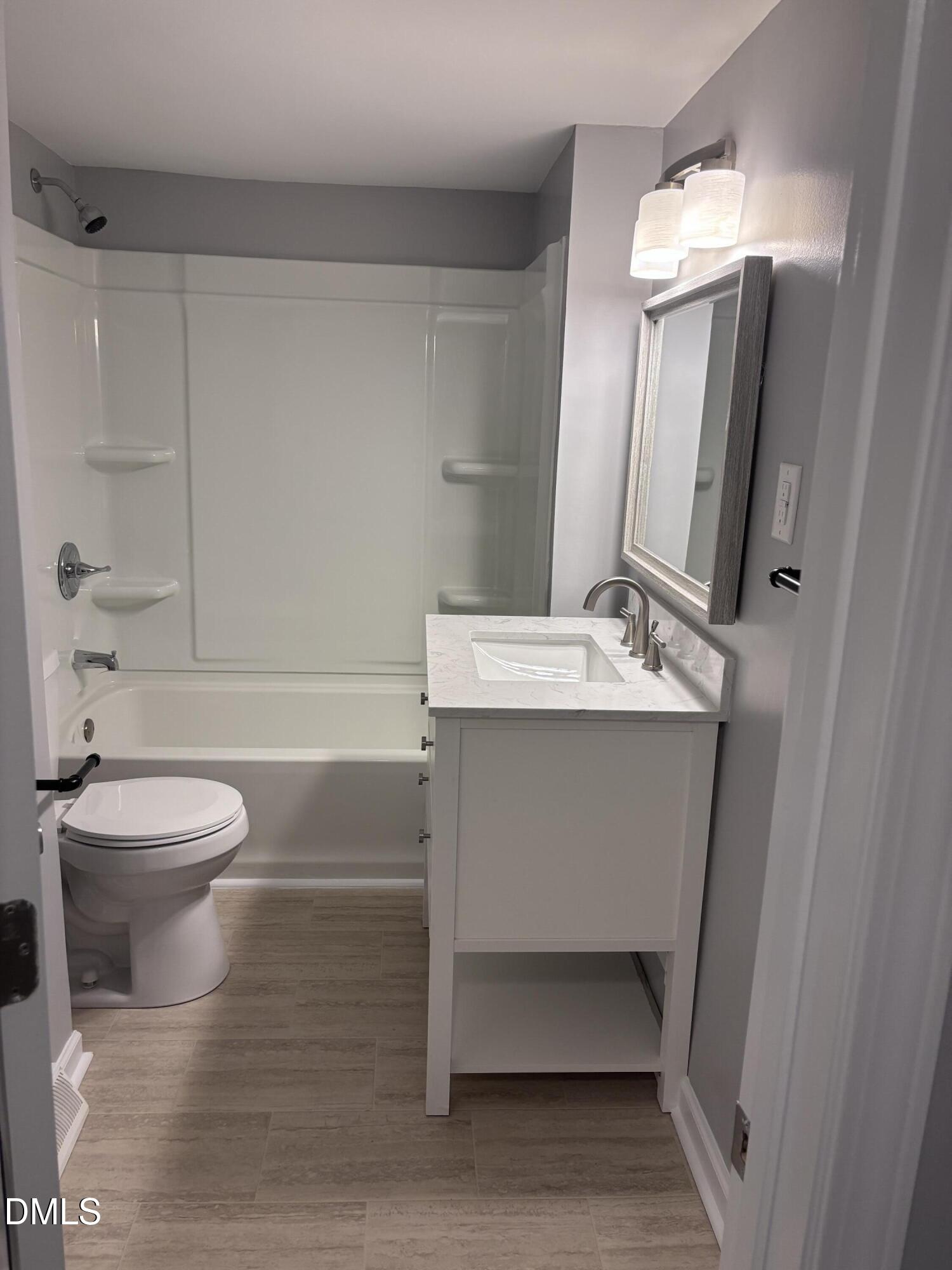 504 St Andrews Church Road Sanford, NC 27332 - Photo 12 of 22 a bathroom with a sink toilet and shower