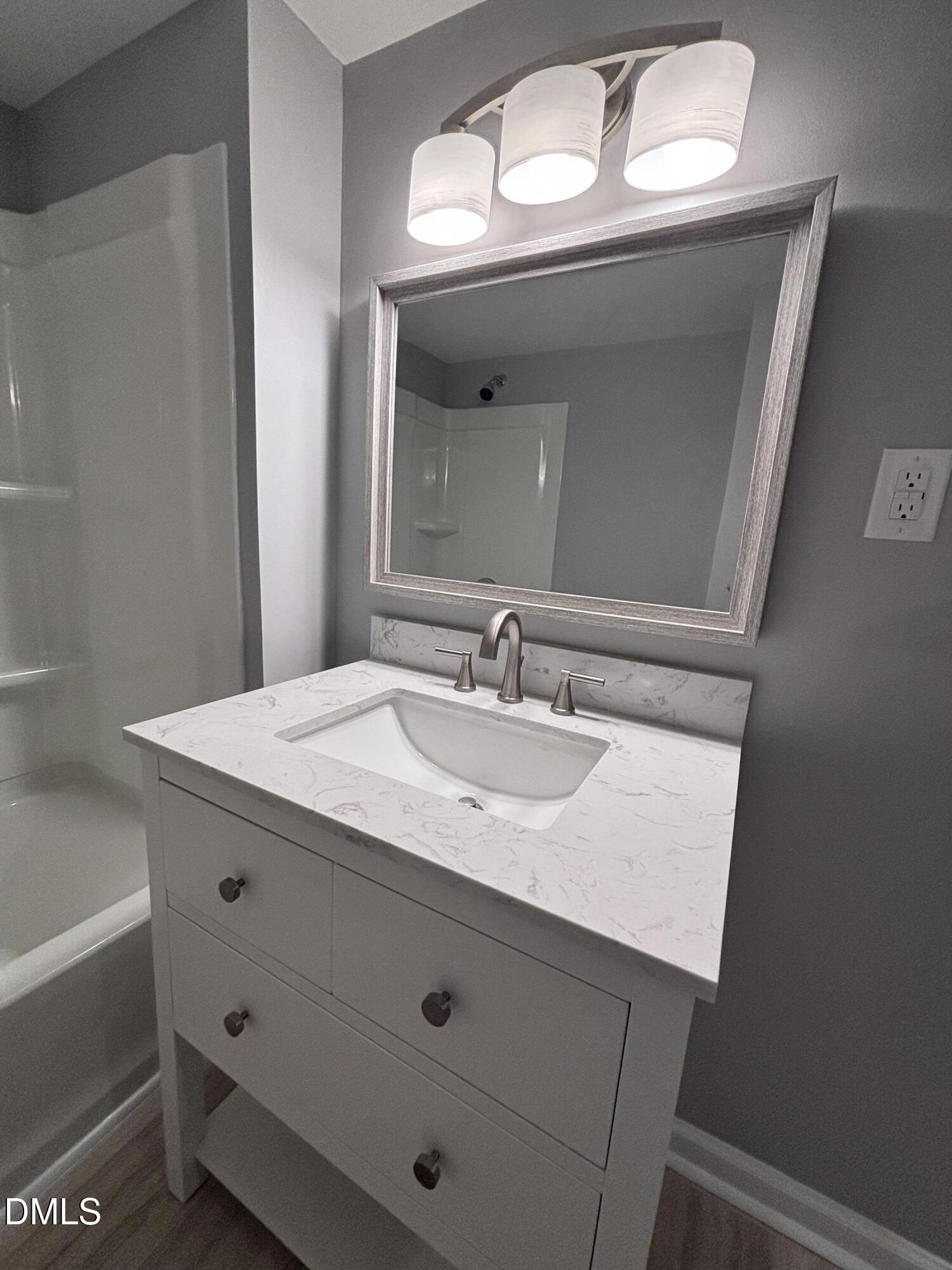 504 St Andrews Church Road Sanford, NC 27332 - Photo 13 of 22 a bathroom with a sink and a mirror