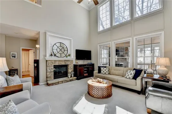 a kitchen with stainless steel appliances kitchen island granite countertop a sink stove and cabinets