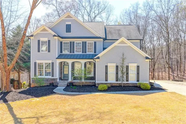 a view of a house with outdoor seating area