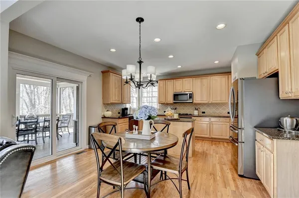 a kitchen with granite countertop a stove a sink and a granite counter tops