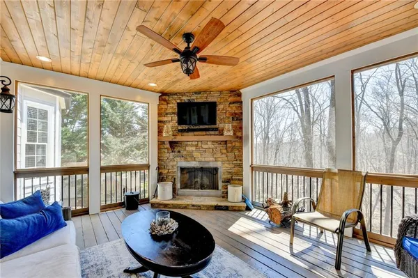 a living room with furniture a window and a chandelier
