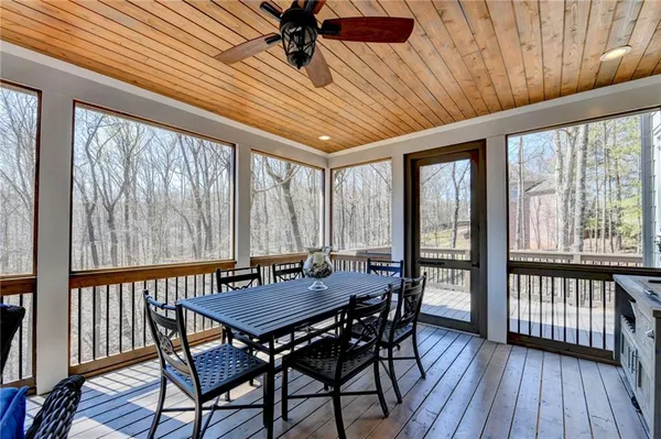 a view of a livingroom with furniture and chandelier fan