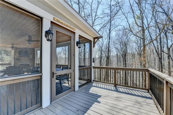 a view of a livingroom with workspace and a window