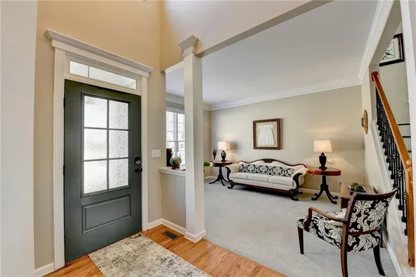 a view of a dining room with furniture and wooden floor
